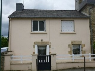 Village house with garden and garage..