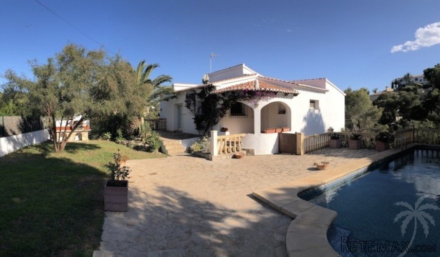 This villa with private pool is surrounded by pine trees..