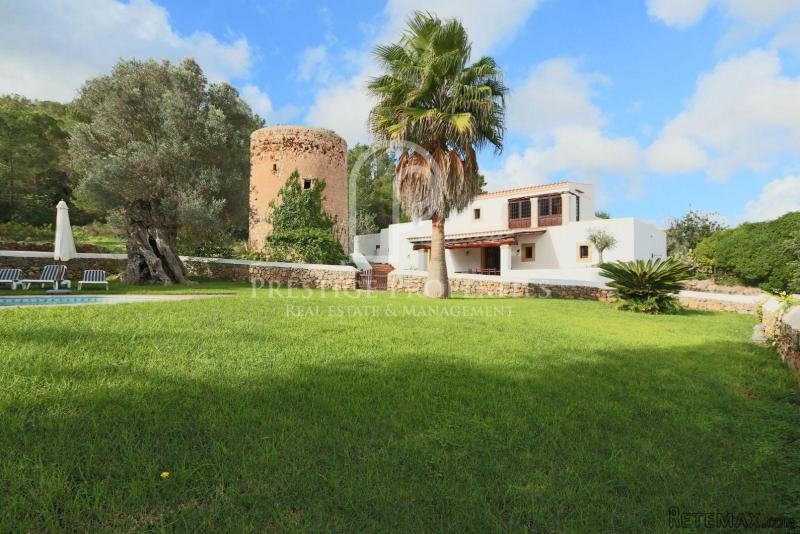 House with antique tower and pool five..
