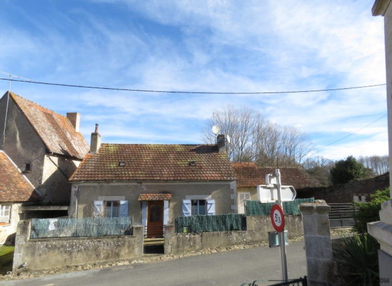 Village house with garden and garages.