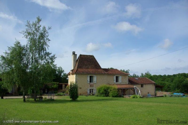Restored stone house with outbuildings..