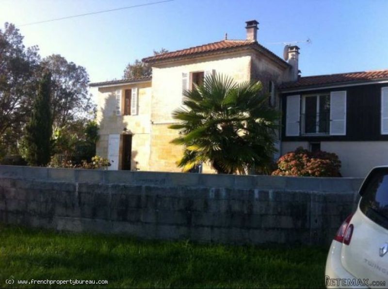 Restored stone house with view over the..
