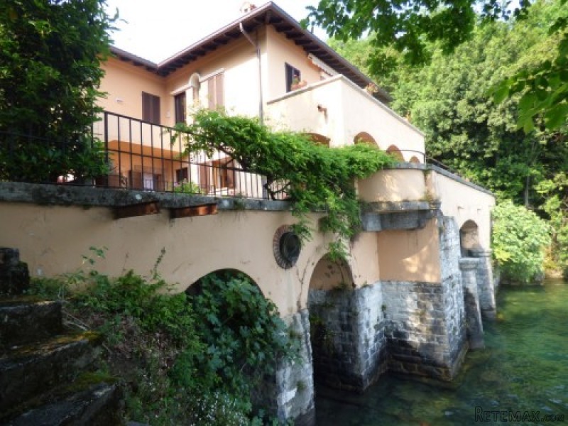 Lakeside apartment with boathouse..