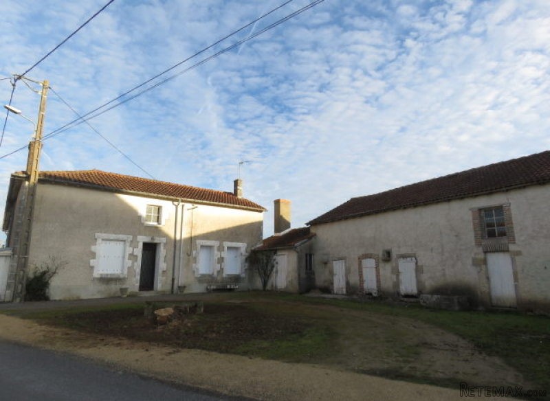 Farmhouse and barn on outskirts of..