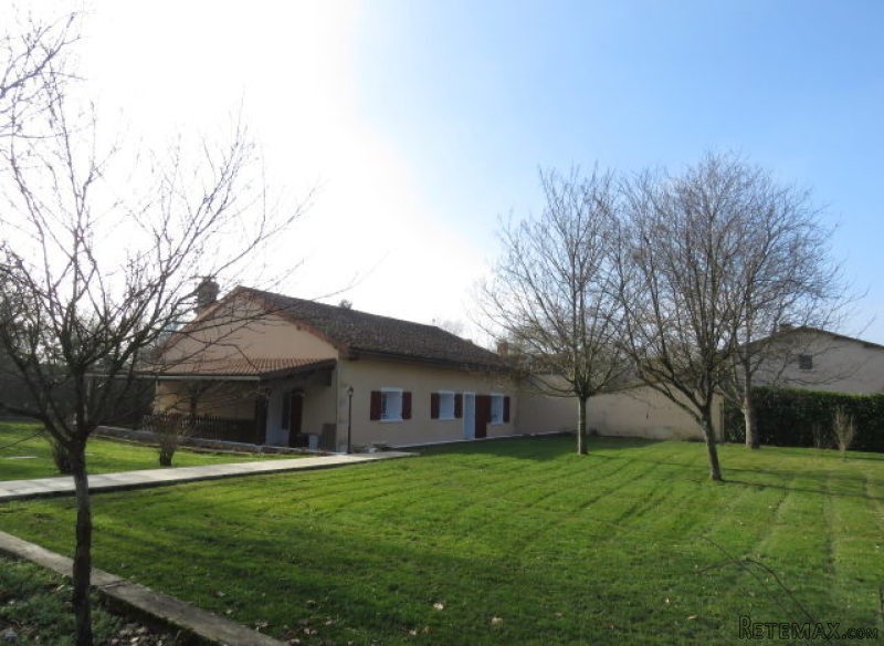 Bungalow with large garden and garages.