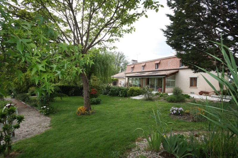 Pretty stone house with attached barn..