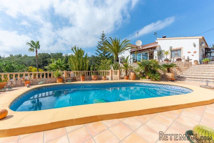 Located in a quiet cul-de-sac, this Mediterranean villa..