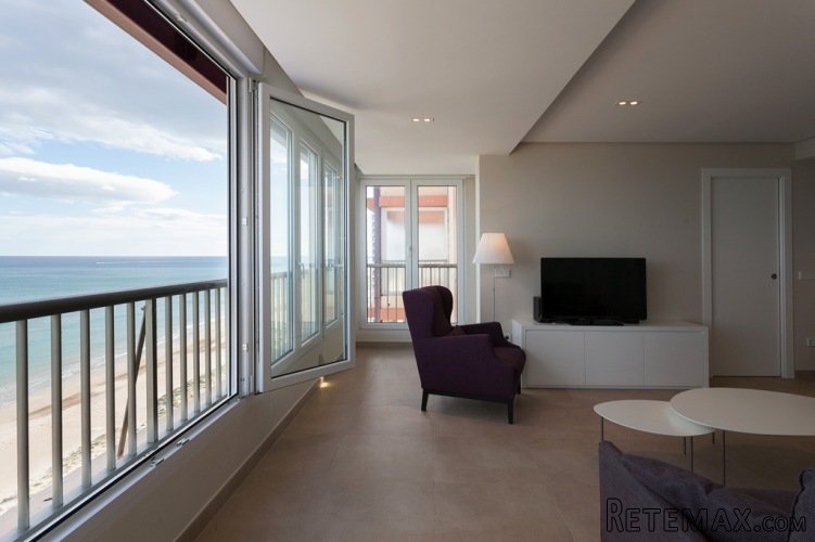 Located beachfront with natural protected dunes. Panoramic..