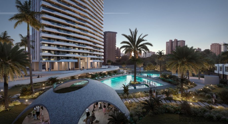 Una imponente torre de vidrio de apartamentos con..