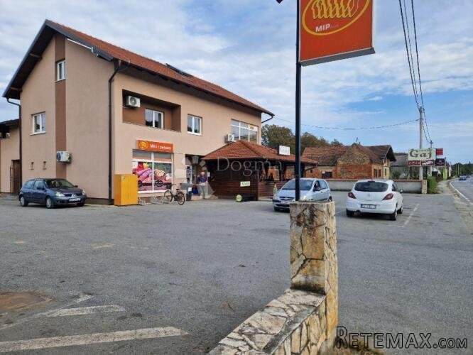 Kuća s poslovnim prostorima i dodatnim zemljištem - odlična