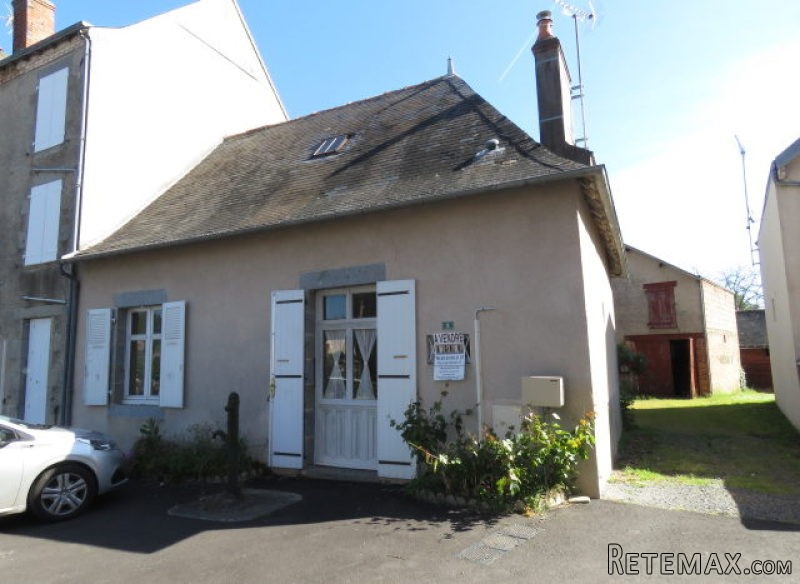 Cottage on village square with an acre.