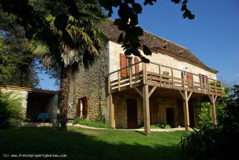 Restored house with outbuildings in..