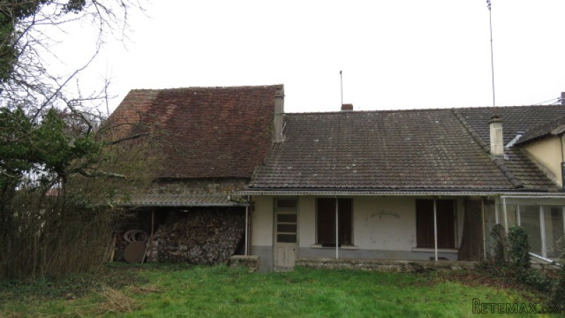 Cottage with attached barn and 5 acres..