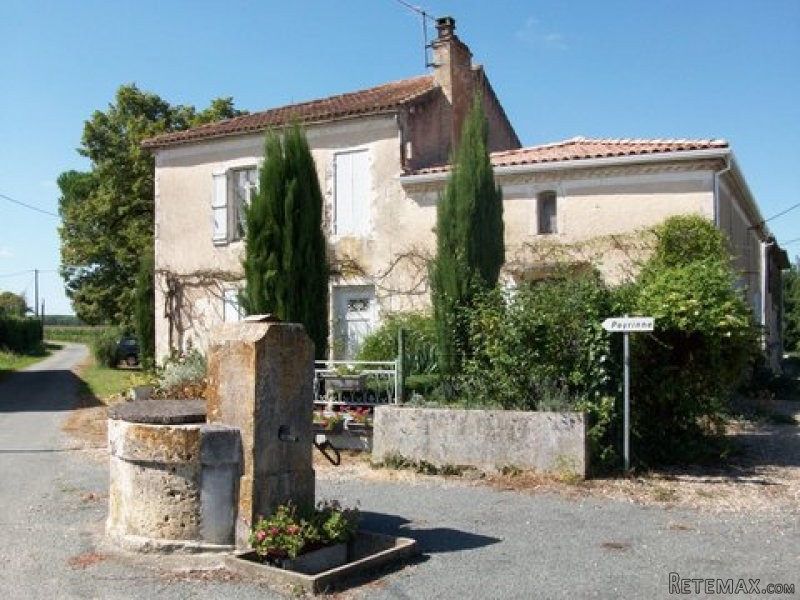 A Pretty Stone House On The Edge Of A..