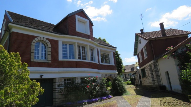 Two houses with big riverside garden..