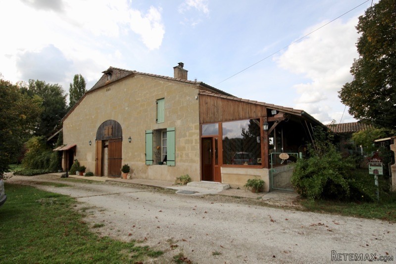 Stone farmhouse with attached barn and..