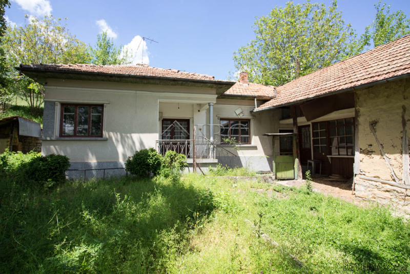 House with big stone-built barn near..
