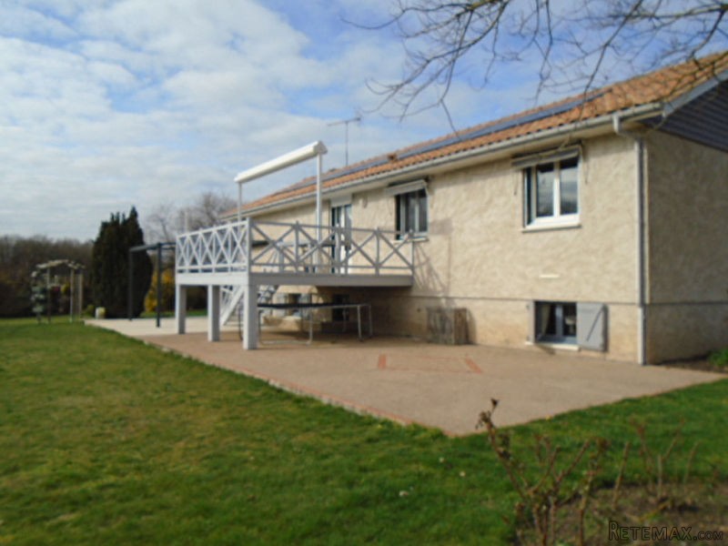 House with Landscaped Gardens