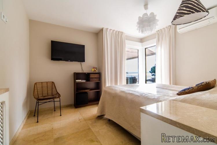 Seafront apartment in Cas Catala with an expansive private..