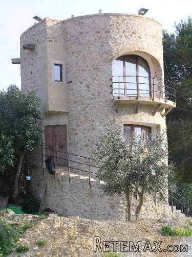 Unusual property. Historic stone tower and toolshed on a..