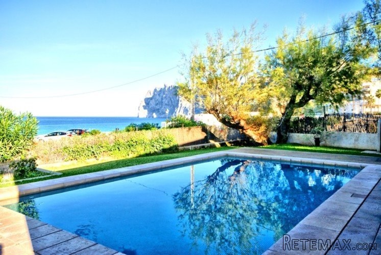 First line modern house in Cala San Vicente with amazing..