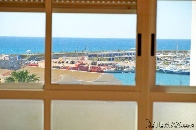 A penthouse in the port of Torrevieja, facing south with a..