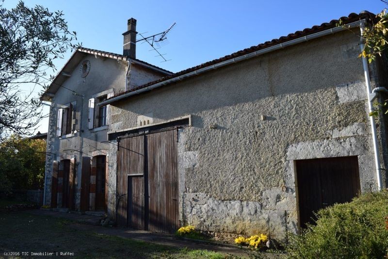 Stone house situated in a village with..