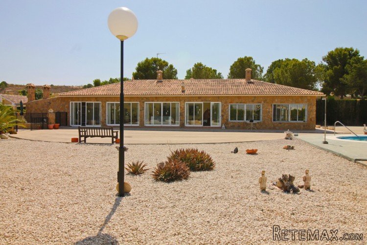 The villa boasts a fully fenced plot, accessed via electric..