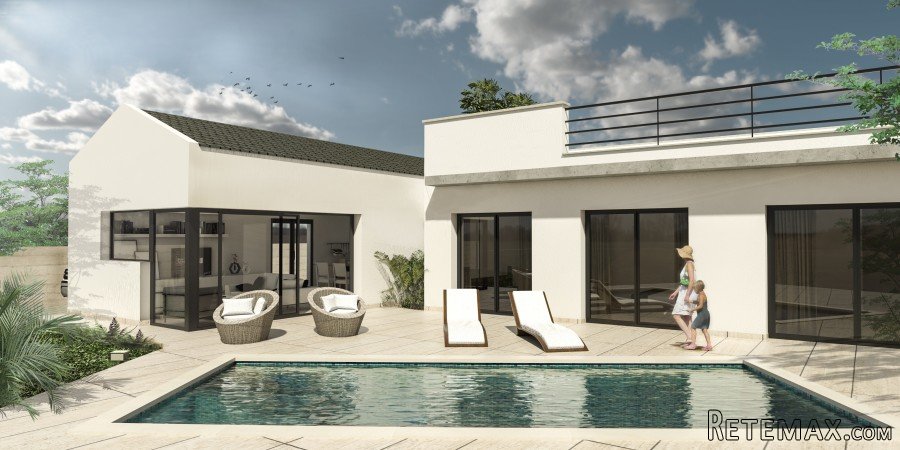 This villa is quietly situated in the urbanization of La..