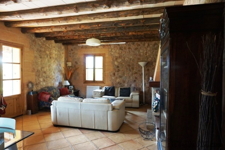 The house is situated on a private road, next to a forested..