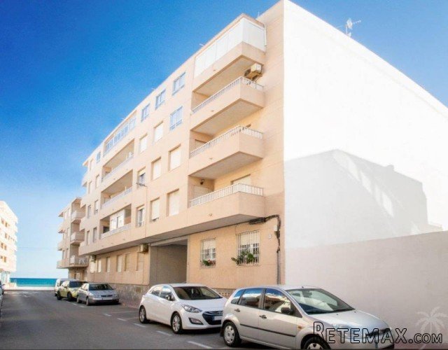 This cozy apartment can be found a few steps from the beach..