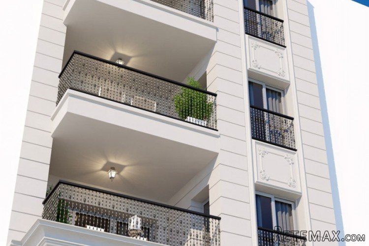 Building of 4 heights with one apartment per floor, all of..