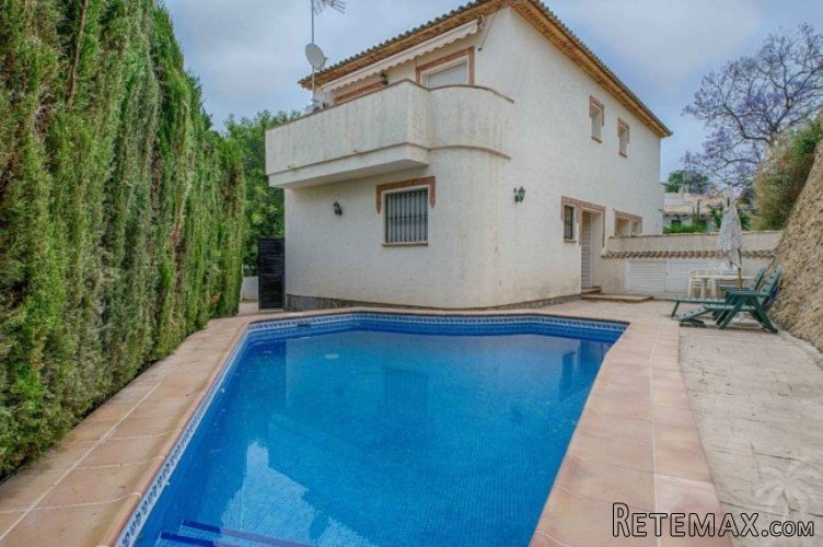 This two-storey semi-detached house with private pool is..