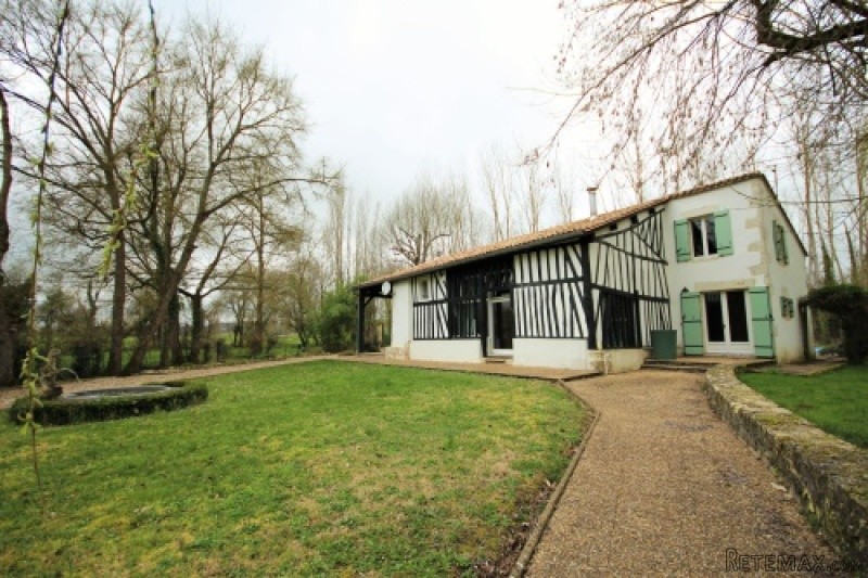 Riverside property with main house and..