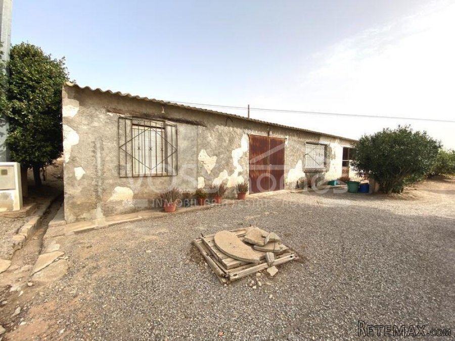 RUSTIC LAND for sale which has a large 400m2 work shop..